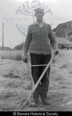 John Macdonald with scythe
