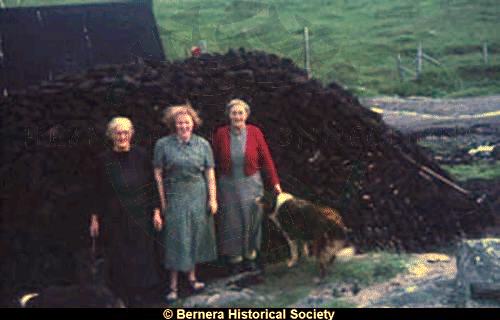 Three Kirkibost ladies at a peat-stack